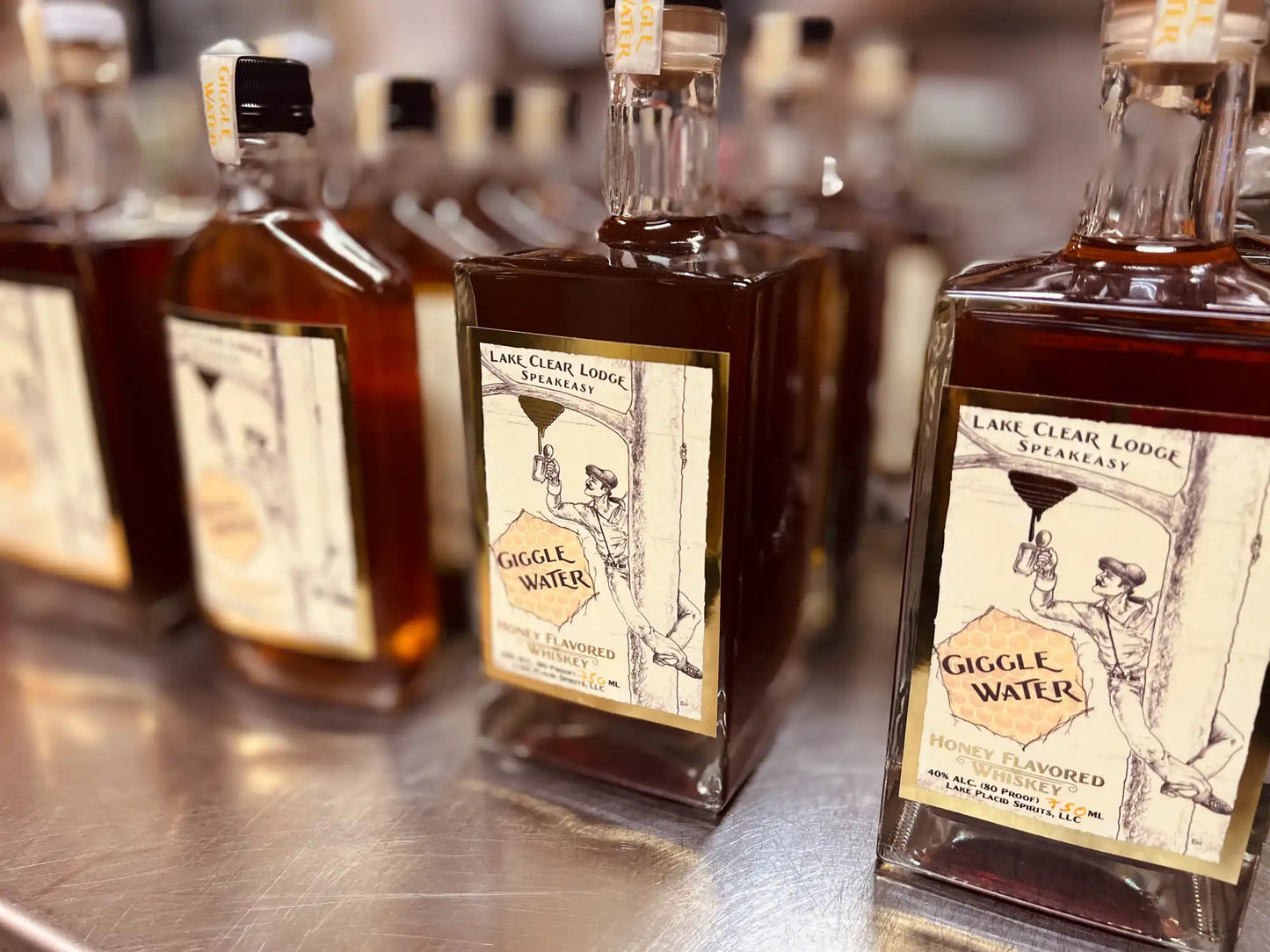 Giggle Water Honey Flavored Whiskey Bottles.