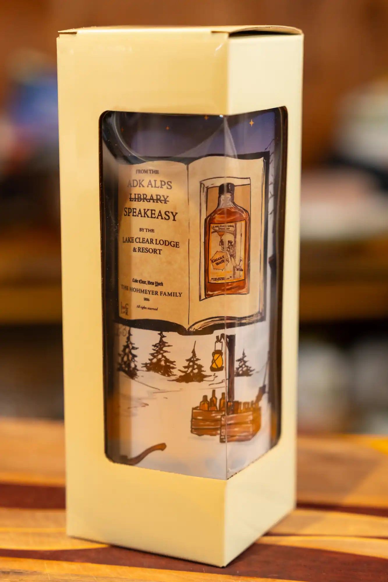 Lake Clear Lodge Glow in the Dark Tumbler in a peek-a-boo window gift box (which also glows in the dark). 