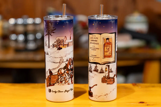 Two holographic shimmer Lake Clear Lodge Speakeasy & Sleigh Ride artwork tumblers.