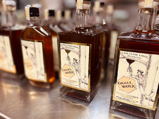 Giggle Water Honey Flavored Whiskey Bottles.